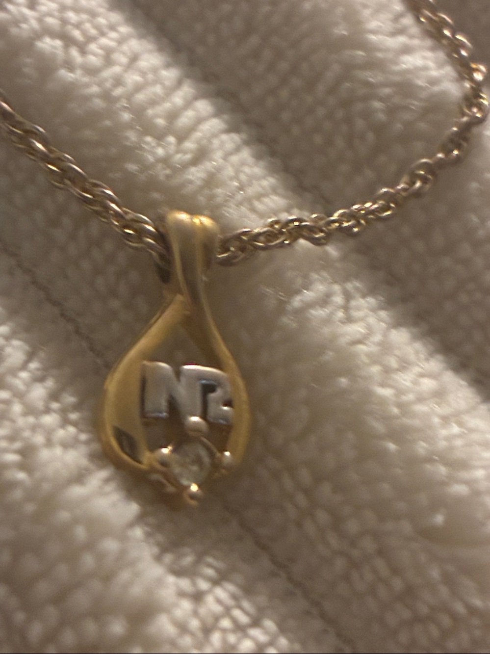Nina Ricci Gold Teardrop Pendant Necklace with Crystal Accent